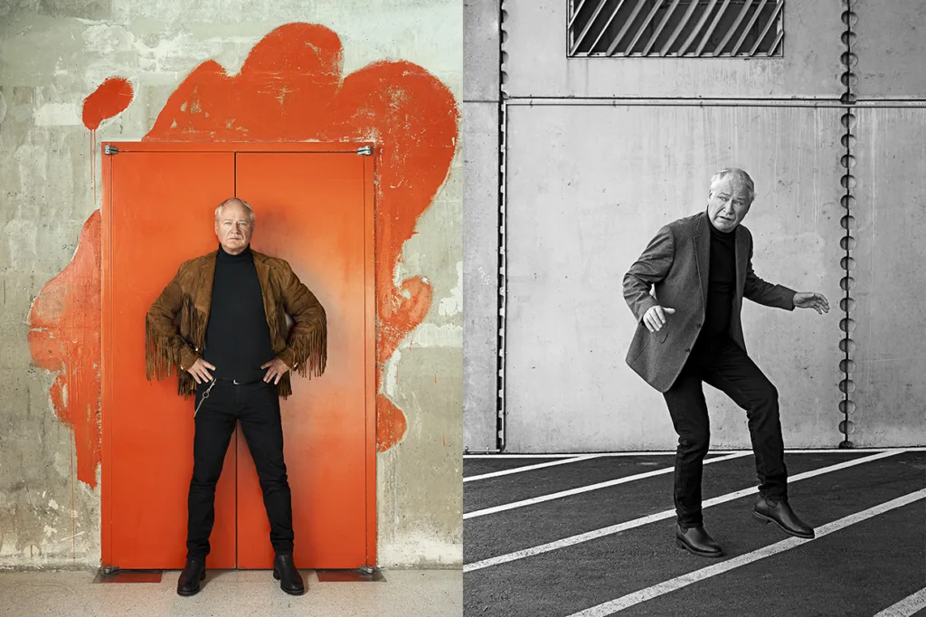 Robert Gustafsson med vitt hår poserar självsäkert framför en ljusorange dörr med målat stänk, iklädd en kavaj med fransar. På ett svartvitt foto bredvid lyfter han lekfullt på en fot på en parkeringsplats iklädd en kavaj.