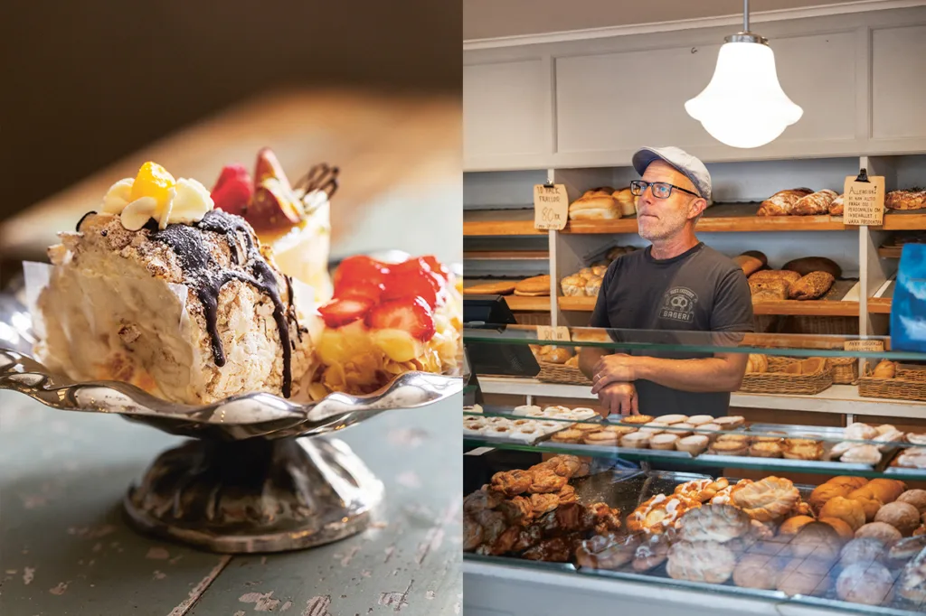 Närbild på olika bakverk med grädde och frukt på ett silverfat, bredvid en man i glasögon och keps som står bakom disken i ett bageri fyllt med olika bröd och bakverk.